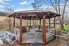 Escape to the outdoor gazebo, a tranquil retreat where you can unwind and enjoy the beauty of your surroundings in comfort! 1028 Cook Rd  Liberty, TN 37095