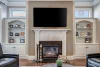 Deep cabinets, gorgeous millwork, and the warmth and glow of a cozy fire at the flick of a switch