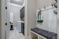 Adorable drop zone in family foyer; there is a huge closet to the right