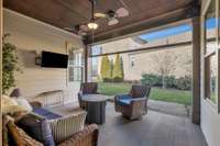 Secluded patio with gorgeous stained tongue and groove ceiling and an electronic screen