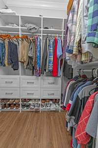 One of the two large walk-in closets in the primary bathroom.