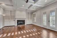 Family room with built-ins, gas fireplace and coffered ceiling! Step right out on to your screened porch.