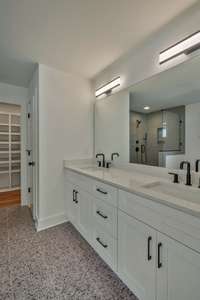 Beautiful owner's bathroom has double vanity, soaker tub, amazing shower and huge walk-in closet with built-in shelving.