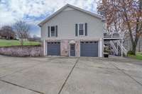 A large parking area outside of your 2 car side load garage.  A door provides additional access into the garage.