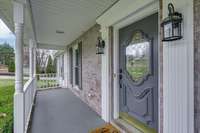 A large front porch welcomes you to this lovely home.