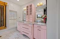 Custom cabinetry and double vanities, allow ample storage