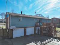 Two car garage and deck. Enjoy the hot tub as well.