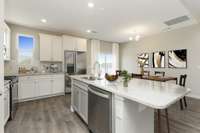 Kitchen B features large island with granite or quartz overhang for barstool seating.