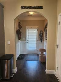 Welcome home to this inviting entry with laundry room to the side, included with cabinets and shelving to make laundry day a breeze.