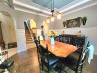 Adjacent to the kitchen is a spacious dining area, perfect for hosting dinner parties or enjoying meals with your family.