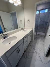 primary bath with tile shower and floor These may be of a different townhome but it is the same floor plan