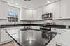 Granite counter tops with tons of cabinet storage. All Appliance convey.