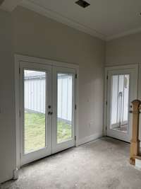 In the kitchen, french doors to the backyard.