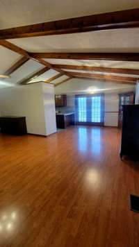 Spacious great room which includes dining area. Nice for entertaining.