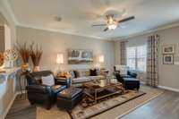 Stock photo showing Great Room at entrance with large cut out window between this room and kitchen