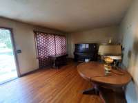 Enter into this Living Room with these beautiful original sand and finish Hardwood Floors. The back wall joins the kitchen for an opportunity to make it open to your choosing (or leave it closed as there is a doorway that leads to the dining area)