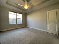 First Floor Master Bedroom w/Tray Ceiling and Ceiling Fan