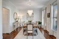 The dining room's beautiful half wall molding lends a nice formality, while the ceiling medallion display's the gorgeous chandelier.