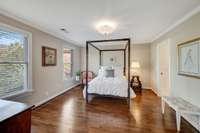 A roomy 2nd floor bedroom, with ensuite bath, looks out onto the manicured grounds.