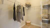 Primary Closet. Pictures are of previously completed home of same floorplan. Listed home features and colors can vary.