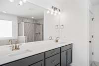 The ensuite owner's bathroom is equipped with dual sinks and lots of storage.