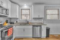 Enjoy cooking in your newly renovated kitchen with granite counter tops, stainless steel appliances, and shaker cabinetry.