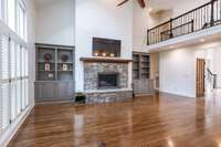 Vaulted ceilings, a wood burning fireplace and skylights truly make this an impressive living room.