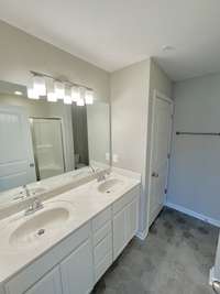 The primary bath features double vanity and a walk in shower