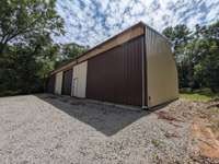 Second barn near the horse pastureland large enough for farm implements, hay storage or private collections.