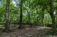 Stone pathway to the front fishing pond