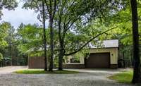 Two-story barn to hold large farm implements. 3/4 Bathroom included.
