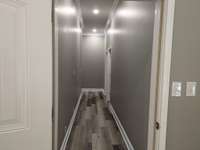 Closed or open hallway that leads to two bedrooms and a newly installed bathroom