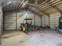 Second barn near the horse pastureland large enough for farm implements, hay storage or private collections.