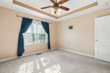 Master bedroom with tray ceiling