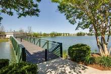 Walking bridge crossing lake.