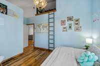 Upstairs guest bedroom with custom loft area.