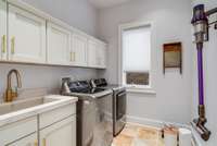 The completely new laundry room is spacious, with plenty of storage.