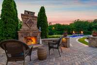 The striking outdoor gas fireplace makes a great place to gather.