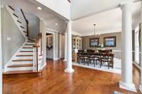 The hardwood floors lead to a beautiful dining room with crown molding.