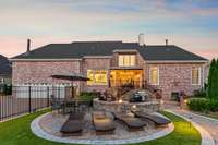 The landscape lighting and expansive paver patio create an ambiance perfect daytime or night time entertaining.