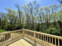 You don't get privacy like this on many townhomes. Wooded area has a creek that runs through it so no homes can be built directly behind you.