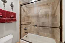 Tile Surround Shower/Tub Located In Full Bath On Second Level