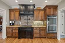 Kitchen With Cooktop And Stainless Steel Double Ovens