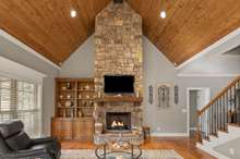 Great Room With Stunning Vaulted Tongue & Groove Ceiling With Gas Stone Fireplace