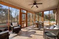 Enjoy All That Mother Nature Has To Offer On This Screened In Porch With Tile Flooring