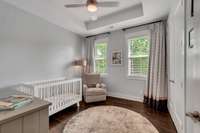 Bedroom #3 Includes: Tray Ceiling, Lighted Ceiling Fan, Closet with Custom Built-In Wood Shelving, 2-inch Blinds, and Hardwood Flooring