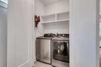 Large Laundry Closet with Built-in Shelving on 2nd Floor