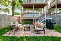 Large Brick Patio accommodates outdoor furniture and makes a great grilling area.