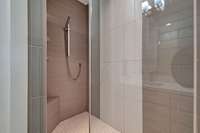 Fully Tiled Walk-in Shower with Rainfall Head, Handheld Sprayer, and Shower Shelf