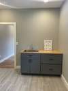 Butcher block counter top and sink in the laundry room